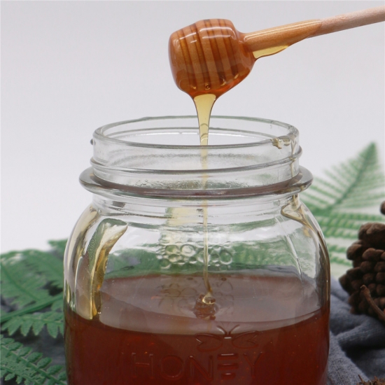العسل الطبيعي الأصلي النقي العنبر النقي في زجاجة 